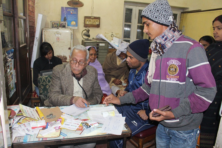 Dr Mukherjee taking 5 rs coin from a patient
